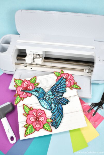 Colorful hummingbird craft with cardstock paper and a Cricut Maker 3. 