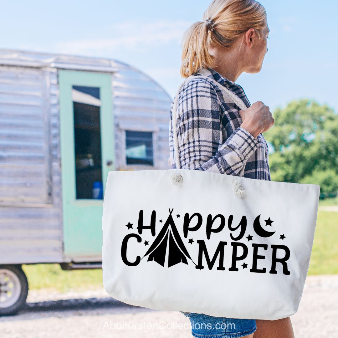 Happy camper SVG file on a linen tote bag. 