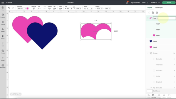 Naming layers is available in Cricut Design Space updates. The example is shown in a screenshot of the canvas page with a pink and blue heart design next to a partial pink heart. 