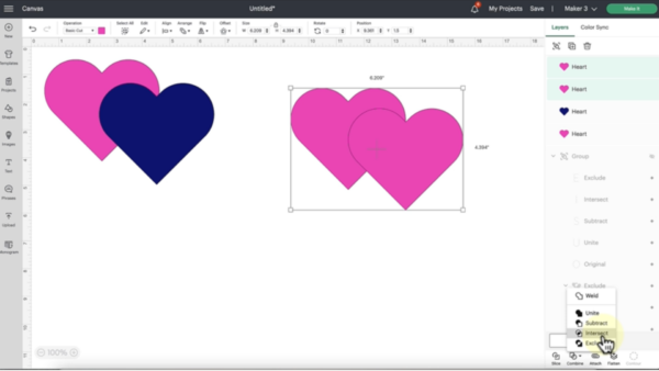 This screenshot of Design Space updates shows a pink and blue heart set next to a pink and pink heart set. The intersect tool is being used here. 
