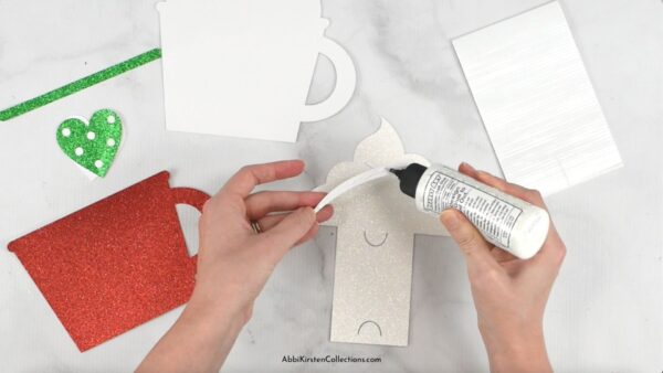 Image shows the gift card holder being assembled with bearly art glue.