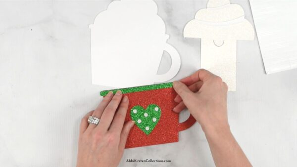 Making the red and green Christmas gift card holder. 