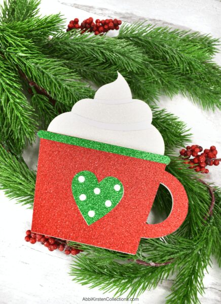Dress up your gift cards with a DIY gift card holder. Use your Cricut to make these coffee cup card holders. Download the free SVG cut files.