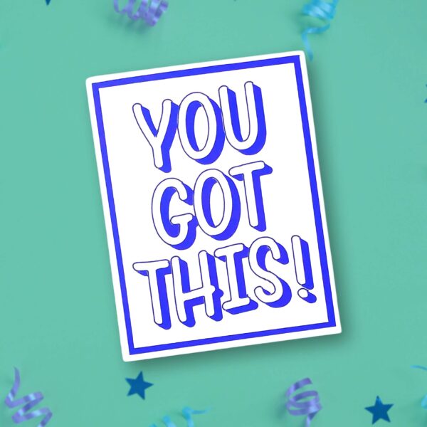 An inspirational card reads "You got this!" in white with blue shadows. The card is on a blue-green background with a few blue stars and ribbons scattered about.