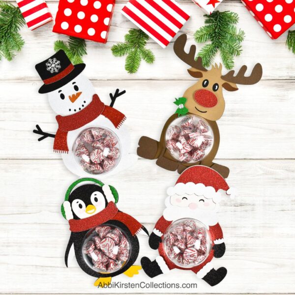 Christmas candy holders. Image shows a Santa Claus, Reindeer, Penguin and Snowman candy holder craft. 