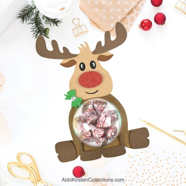 Rudolph reindeer paper craft with plastic candy holder. 