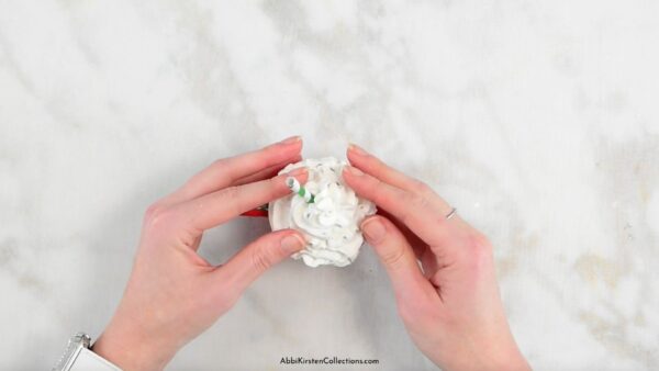 Glue on the faux whipped cream