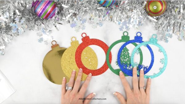 Image shows size layers of the Christmas tree paper ornament craft. 