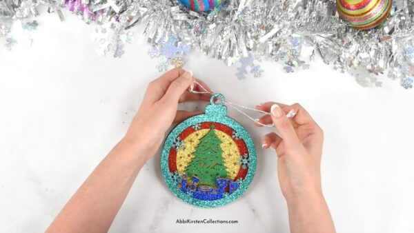 How to add a string to the ornament.