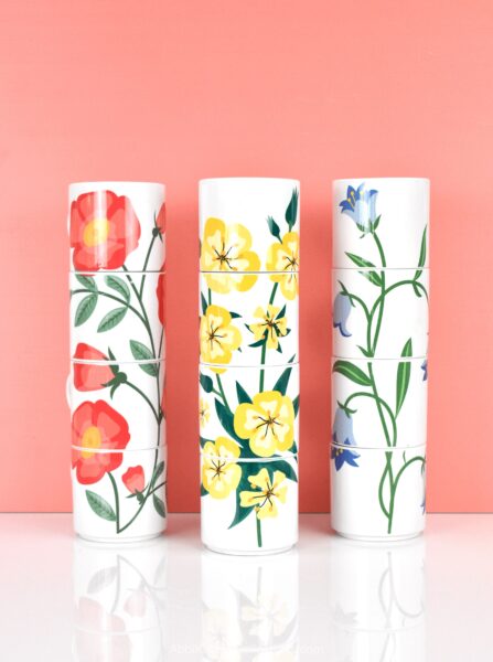 The images shows three stackable mug sets created with sublimation using Cricut Design Space, a mug press and free images on Abbi Kirsten Collections