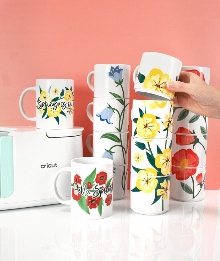 The image shows stackable mugs with a floral design created using sublimation.
