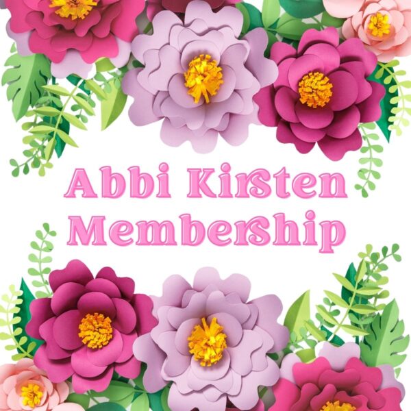 Light purple and dark pink paper flowers along with paper greenery frame the words "Abbi Kirsten Membership."
