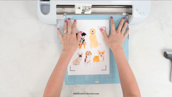 The image shows how to load a Cricut mat with for Print Then Cut stickers.