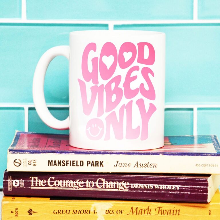 Coffee mug featuring 'Good Vibes Only' text, handcrafted using a Cricut machine and heat-activated color-changing vinyl