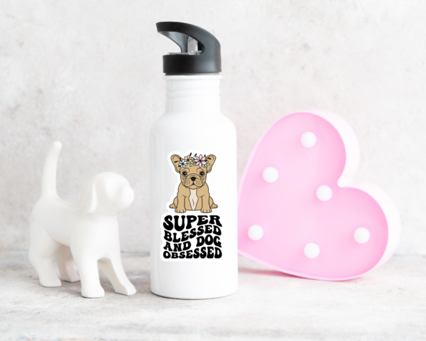 White water bottle with a french bulldog sticker on the front that say, bless and dog obsessed. 