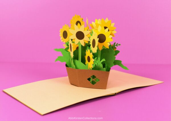 Sunflower basket pop up card made from cardstock on a pink background