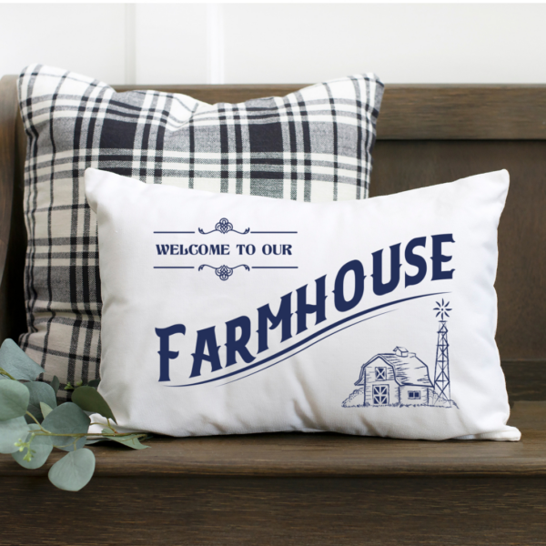 Welcome to our farmhouse free SVG cut file shown on a while pillow with dark blue vinyl. 