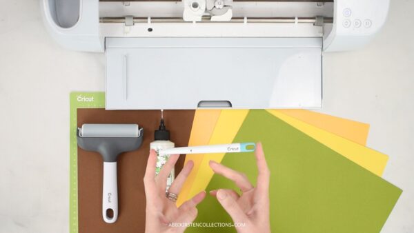 Cricut machine with cardstock and scoring stylus to make pop up cards