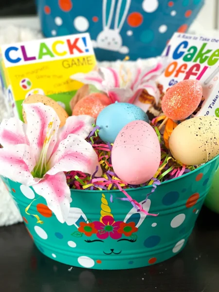 Free SVG of Green Easter basket with pastel eggs and grass and pink lily.