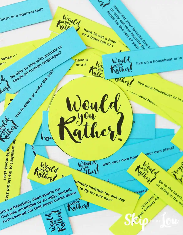 Teal blue and lime green slips of paper are scattered on a table. The center has a circle cutout that reads “Would You Rather?” Each lunch box note has a “Would You Rather” question that will bring fun to your kid’s day. These free printable lunch box notes are from Skip to my Lou.