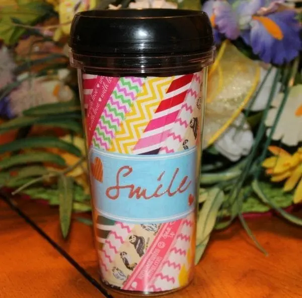 Colorful travel mug decorated with washi tape and text Smile