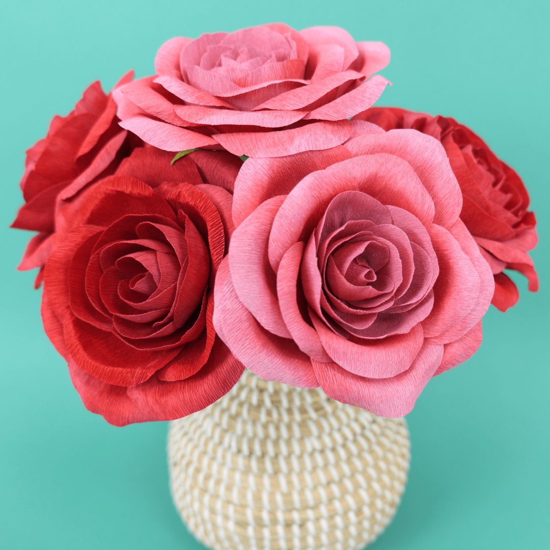 vase full of red crepe paper roses