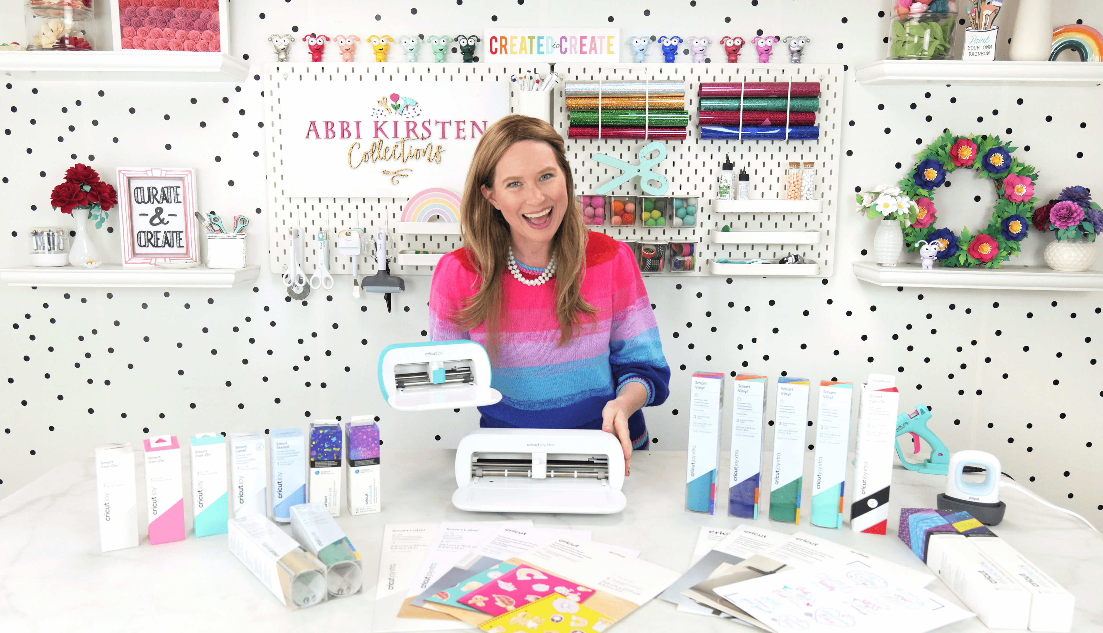 Abbi Kirsten holding the Cricut Joy machines.